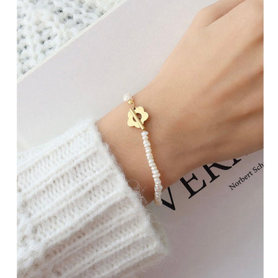 BRACCIALE CON PERLE DI FIORI